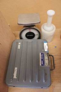lot 425 image: Pelouse Scale 100lbs., Dymo Scale 50Lbs., and Hand Held Shrink Wrapper