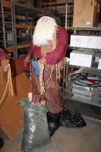 lot 579 image: Life-Size Western Santa Suede Vest and Chaps, Flannel Shirt, Bag of Toys (Still with Tag designed by Tina Mitchell)