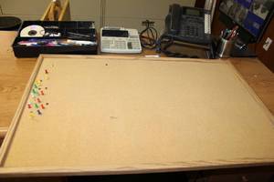 lot 106 image: Office Lot Corkboard, Phone with Stand, Adding Machine, Drawer Sorter, and Dell Monitor