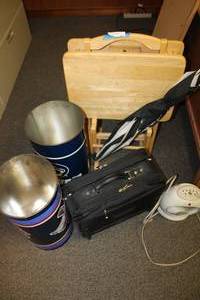 lot 108 image: TV Trays, Umbrella, Samsonite Computer Bag, Team Logo Trash Cans, and Small Space Heater