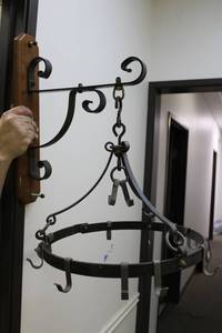 lot 183 image: Cast Iron Pot Hanger with Wall Hanger Tavern Puzzle Collection