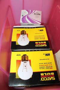 lot 737 image: Light Bulbs and Pink Tub Satco 60W and Allura 60W
