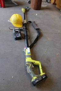 lot 788 image: Ryobi 8 Cordless Pole Saw with Charger and Hard Hat