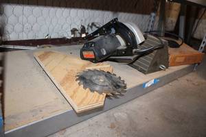 lot 838 image: Sears 7-14 Circular Saw, Wheel Block, and Rubber tubing