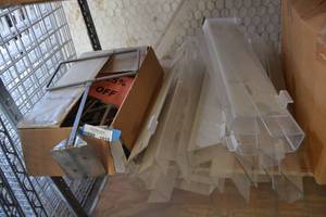 lot 1015 image: 24 Plastic Display Racks and Box of Chrome Sign Holders