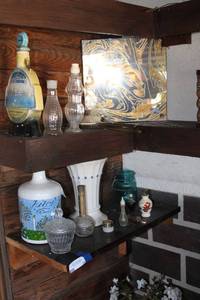 lot 14 image: Contents of corner shelves, vintage perfume bottles decanters and more