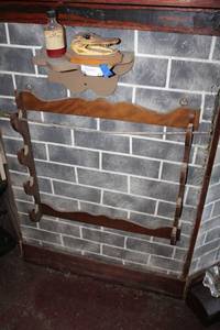 lot 27 image: Gunrack, Gator head, Snake oil and shelf