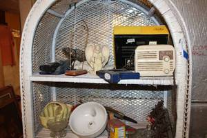 lot 93 image: Contents top two shelves, Vintage radio, vintage water fountain glass and more
