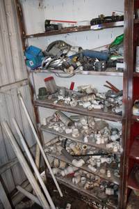 lot 126 image: Contents of shelving unit  lots of plumbing supplies