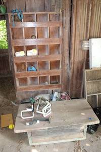 lot 161 image: Mower Seat, wood bin and contents, rolling wood bench and more, ( bring tools to remove)