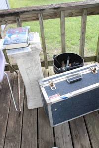 lot 199 image: Travel hard case, planter stand, and books