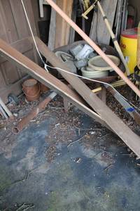 lot 297 image: Wheel barrow with metal handles, Pole Saw and Patio Torches