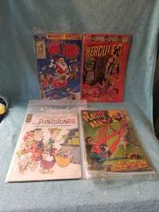 lot 50 image: Selection of 4 comic books - Tom & Jerry, Hercules #11, The Flintstones, and Plastic Man - 12cent comics
