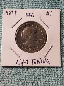 lot 51 image: 1981-P Susan B. Antony dollar coin with light toning - carded