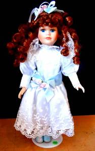 lot 25 image: BEAUTIFUL THE COLLECTORS CHOICE RED HEADED PORCELAIN DOLL WITH STAND $$