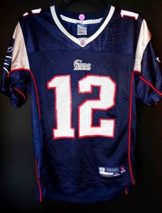lot 27 image: REEBOK ONFIELD PLAYERS JERSEY - NEW ENGLAND PATRIOTS G.O.A.T TOM BRADY #12 - SIZE YOUTH LARGE