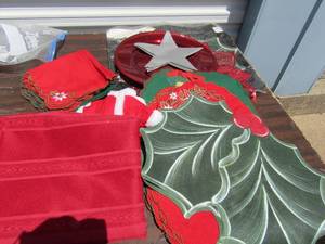lot 36 image: Christmas place setting , serving tray, and red table cloth