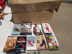 lot 39 image: Large box of assorted VHS and CD movies (kids, war, comedy etc.)