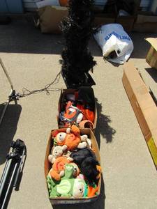 lot 44 image: 51 black lighted Halloween tree, 2 boxes of fall toys, stuffed animals, and spooky music CDs