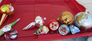lot 53 image: Red tote containing vintage christmas bulbs plus 1989 champagne Neiman Marcus ornament