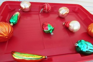 lot 54 image: Red tote containing vintage christmas ornaments