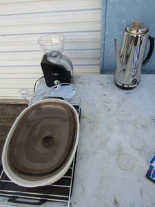 lot 68 image: Oven rack, coffee maker no plug, Starbucks coffee grinder, cookie sheets