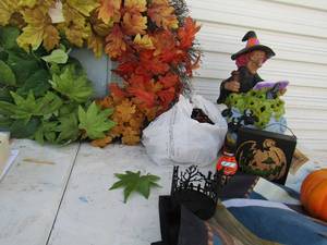 lot 88 image: Halloween door wreath, orange lights, witches brew, jack o lanterns and more