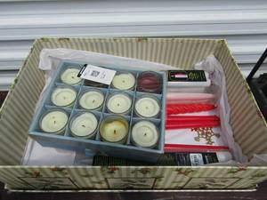 lot 109 image: Box of new tea lights and candle sticks