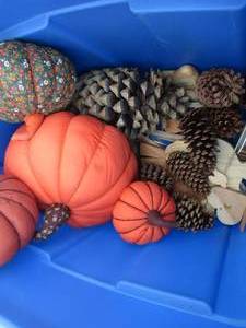 lot 149 image: Misc. tote- jack o lanterns, fabric, pine cones
