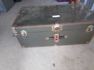 lot 173 image: Green trunk full of pillow stuffing 12x30x16
