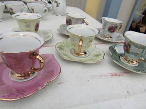 lot 195 image: 6 leaf china tea cups and saucers man & woman design gold trim