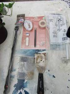 lot 198 image: Lot- Pier one curtain rods, pack of nails, putty knife and more