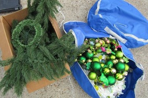 lot 206 image: 2 door wreaths in blue storage bag and box of holiday greenery