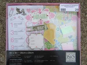 lot 29 image: New baby girl set- ribbon, paper photo book. Stickers etc.