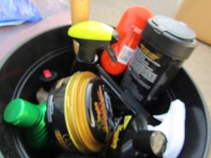 lot 218 image: 2 black planters-BUT WAIT- one is full of CAR DETAILING Products