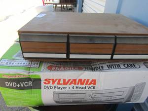 lot 242 image: CASSETTE TAPE HOLDER, SYLVANIA DVD PLAYER W REMOTE