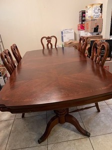 lot 2 image: DARK CHERRY WOOD DINING TABLE WITH 1 LEAF  64 X 44W X 30 H  FROM Havertys ( CHAIRS IN LOT 232)