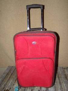 lot 159 image: American Tourister Red Luggage Bag with Wheels And Handle