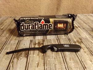 lot 239 image: Gold Duraflame- The Brighter Burning Fire Log & Lighter