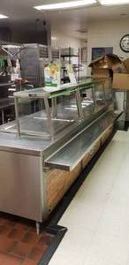 lot 15 image: Long Stainless Steel Serving Line w Cooler & Electric Warmers, Measures 142 x 54 x 36, Contents Not Included
