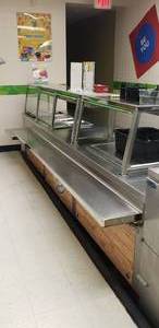 lot 16 image: Long Stainless Steel Serving Line w Cooler & Electric Warmers, Measures 142 x 54 x 36, Contents Not Included