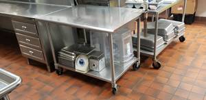lot 21 image: Duke Stainless Steel Rolling Prep Table w Edlund Can Opener, Model 316S M, Contents Not Included