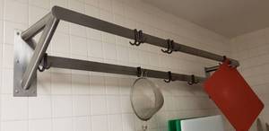 lot 25 image: Stainless Steel Wall Mounted Hanging Rack.  Measures 70