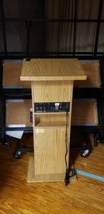 lot 62 image: Oklahoma Sound Corp Speaker Podium w Amp, Mircrophone & Built-In Speakers