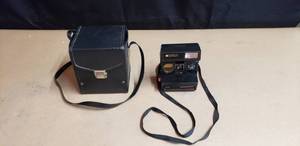 lot 213 image: Vintage Polaroid Sun 660 Auto Foucs Land Camera with Leather Case