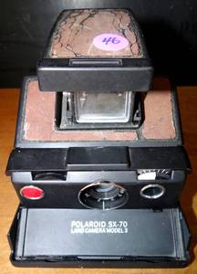 lot 46 image: VINTAGE Polaroid Originals SX-70 Instant Film Camera (Silver and Brown)