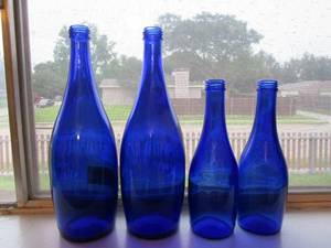 lot 49 image: LOT OF 4 VINTAGE BLUE GLASS TY NANT SPRING GLASS BOTTLES