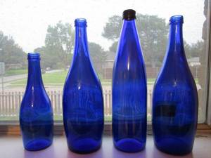 lot 51 image: SET OF 4 VINTAGE&nbsp BLUE GLASS TY NANT SPRING GLASS BOTTLES