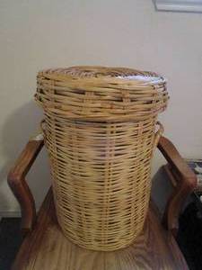 lot 64 image: TALL WICKER BASKET WITH WICKER LID AND SIDE HANDLES.