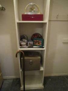 lot 67 image: CONTENTS OF CLOSET SHELVING...CANE, QUARTS CLOCK, LIBERTY NATIONAL COMBO LOCK BOX WITH COMBO # INCLUDED, COLLECTOR TINS, PORTA FILE LOCK BOX NO KEY.&nbsp